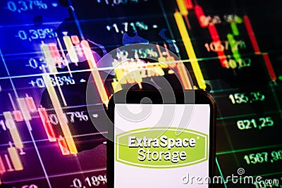 KONSKIE, POLAND - September 10, 2022: Smartphone displaying logo of Extra Space Storage company on stock exchange chart background Editorial Stock Photo