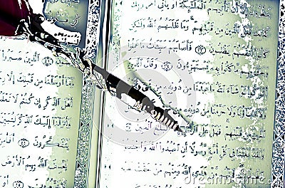 The koran, the holy book of Islam, and an ancient pen Stock Photo