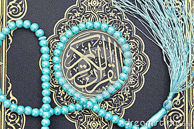 Koran holy book with rosary Stock Photo