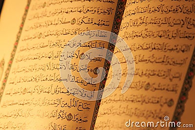 Koran or quran holy book on candlelight Stock Photo