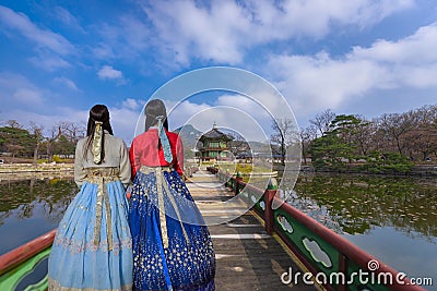 Korea during winter with lady Korean national dress at Gyeongbokgung Palace. Seoul,South Korea. Stock Photo
