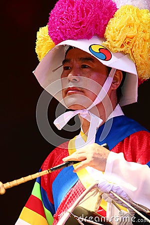 Korean drummer playing the traditional hourglass-shaped drum also known as janggu Editorial Stock Photo