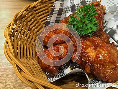 Korean foods. Fried chickens in basket on table. Stock Photo