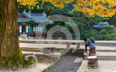 Korean girl sitting at the Pavillion at secret garden Editorial Stock Photo