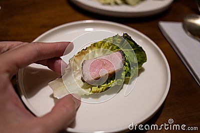 Korean Grilled Iberico Pork on Lettuce Stock Photo