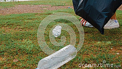 Korean lady volunteers help to keep nature clean up and pick up garbage. Stock Photo