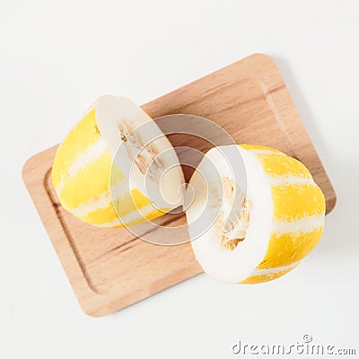 Korean oriental melon on wooden tray on white background Stock Photo