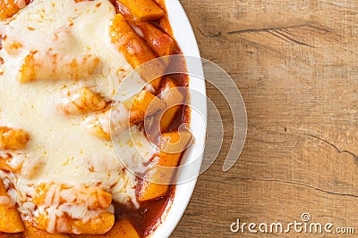 Korean rice cake in spicy Korean sauce with cheese, Cheese Tokpokki, Tteokbokki with Cheese Stock Photo