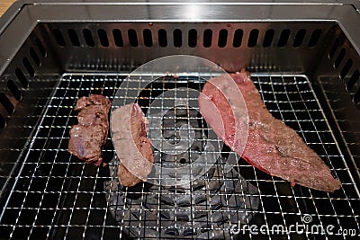Korean Style Barbecue on stainless grill. Stock Photo