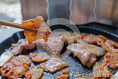 Korean traditional grilled BBQ food, samgyupsal, pork in Lettuce with Chopsticks, Food for camping in winter Stock Photo