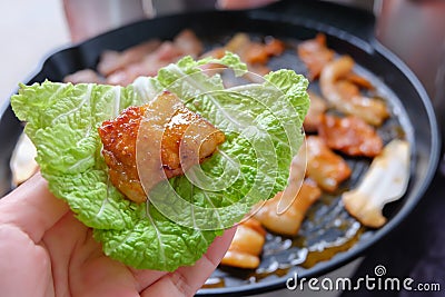 Korean traditional grilled BBQ food, samgyupsal, pork in Lettuce with side dishes, Food for camping in winter Stock Photo