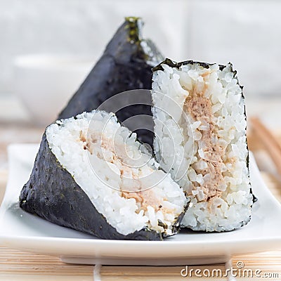 Korean triangle kimbap Samgak made with nori, rice and tuna fish, similar to Japanese rice ball onigiri, square format Stock Photo