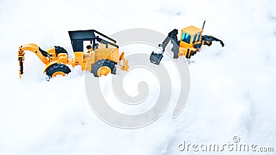 Korean winter, many white snow, icy roads, two large toy forklifts Stock Photo