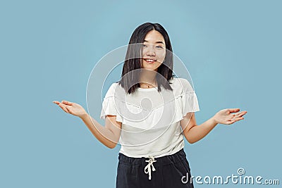 Korean young woman`s half-length portrait on blue background Stock Photo
