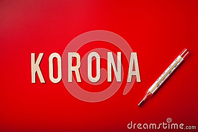 Korona norsk norwegian word text wooden letter on red background corona virus covid-19 Stock Photo