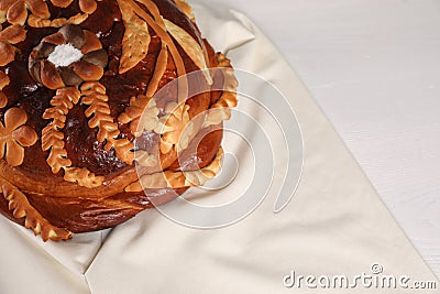 Korovai on white table, above view. Ukrainian bread and salt welcoming tradition Stock Photo