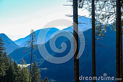 Kosmatitza - Panoramic view of misty Karawanks mountain range on sunny day in Carinthia, Austria Stock Photo