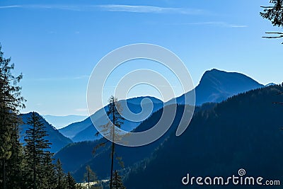 Kosmatitza - Panoramic view of misty Karawanks mountain range on sunny day in Carinthia, Austria Stock Photo