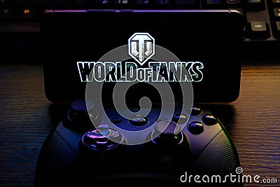 Kostanay, Kazakhstan, February 12, 2020.Joystick and mobile phone with the logo of the popular game World of Tanks, from Wargaming Editorial Stock Photo