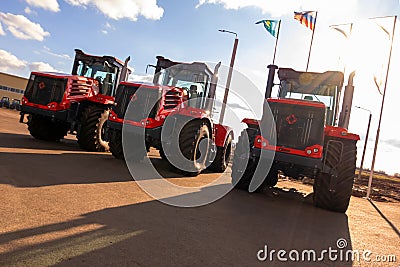 Kostanay, Kazakhstan, 2019-10-23, Three red Kirovets tractor in the area of the factory territory. International Russian-Kazakh Editorial Stock Photo