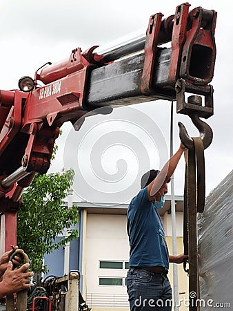 Photo of lorry crane operator. Editorial Stock Photo
