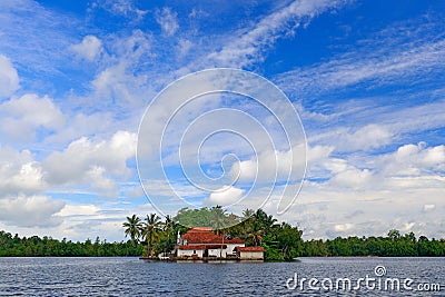 Kothduwa temple, or Koth Duwa Raja Maha Viharaya, Buddhist temple, Madu Ganga clouds with dark blue sky. Bentota river, Sri Lanka. Stock Photo