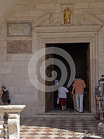 People entering in St. Tryphon Cathedral in Kotor Editorial Stock Photo