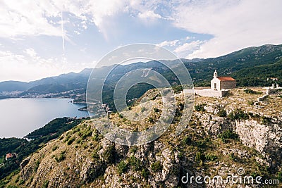 Kotor, Montenegro - 08.06.17: Church of Sveti Savva on the mountain above the island of Sveti Stefan, Montenegro Editorial Stock Photo