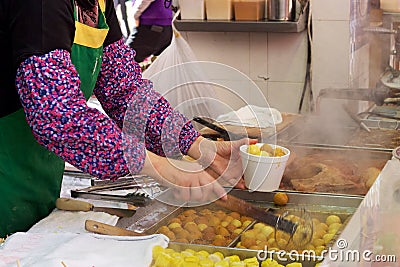 Kowloon, Hong Kong street food vendor serving fried fish balls Editorial Stock Photo