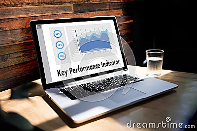 KPI acronym (Key Performance Indicator) Business team hands at w Stock Photo