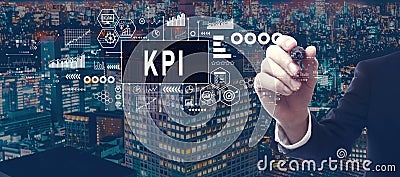 KPI - Key Performance Indicator theme with businessman in city at night Stock Photo