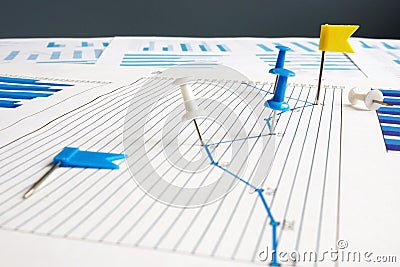 KPI key performance indicators. Thumb tacks and business papers Stock Photo