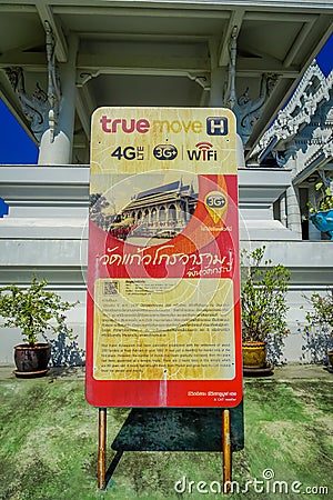 KRABI, THAILAND - FEBRUARY 19, 2018: Close up of informative sign at the enter of white temple, Wat Kaew Korawaram. This Editorial Stock Photo