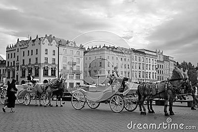 The most romantic way to tour Krakow is by the horse-drawn carriages t Editorial Stock Photo