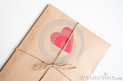 Kraft envelope with red heart Stock Photo