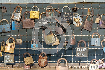 Krakau August 22nd 2017: several locks attached to the side of a Editorial Stock Photo