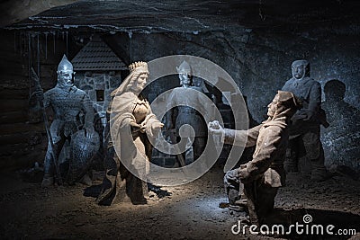 Wieliczka Salt Mine underground scene with statues carved by miners out of the rock salt, Krakow, Poland, tourist landmark Editorial Stock Photo