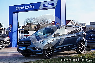 Krakow, Poland 03.15.2020: Blue Ford Kuga in the Parking lot of the Commission car center among other cars . Sale of Commission u Editorial Stock Photo