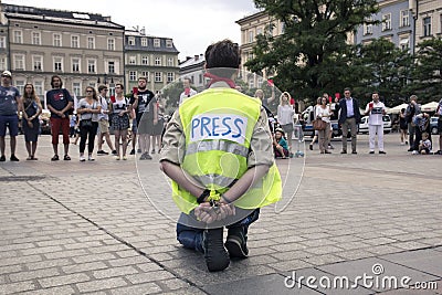 Krakow, Poland, June 01, 2018, A lonely man in the press vest a Editorial Stock Photo