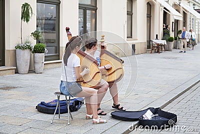 Women playing banduras outdoors Editorial Stock Photo