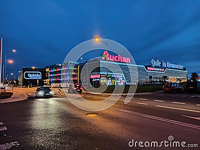 Krakow, Poland: Wide angle shot of a hyper market named galeria Bronowice with Auchan super market brand logo on Editorial Stock Photo