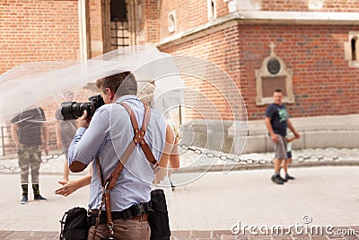 The photographer takes pictures of the bride Editorial Stock Photo