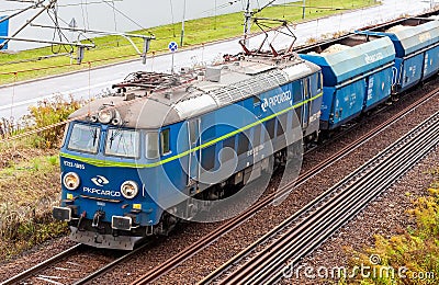 Krakow, Poland, polish PKP cargo train front closeup, rail transportation and logistics abstract concept. Freight train moving Editorial Stock Photo