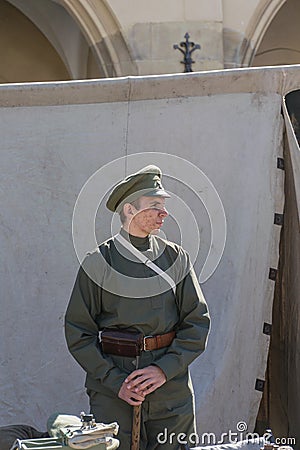 Krakow, Poland - September 23, 2018: nYoung Man dressed in Polish uniforms from World War I among tourists at krakow`s Editorial Stock Photo