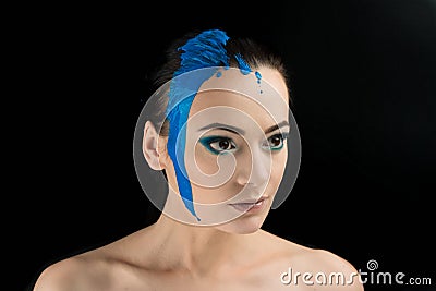 Face paint makeup. creative makeover. the blue color on the face Stock Photo