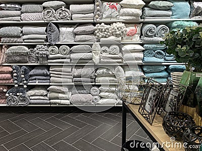 Home Decorations In Decorations Store. Modern textile shop for towels and interior decor. Editorial Stock Photo