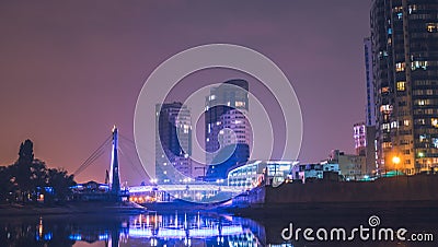 Krasnodar, Russia - 20 October, 2018: Night view of the Bridge Of Lovers and Krasnodar City, Russia. Editorial Stock Photo