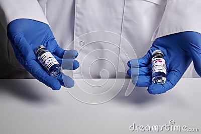 Doctor Offers Astrazeneca and Sputnik-V Covid Vaccines - Medical Lab Photo Editorial Stock Photo