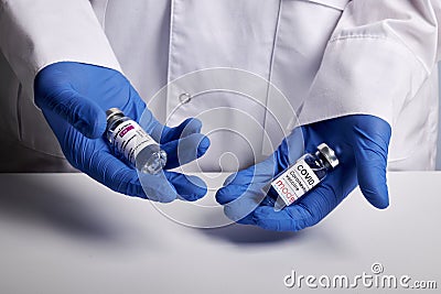 Doctor Offers Moderna and Astrazeneca Covid Vaccines - Medical Lab Photo Editorial Stock Photo