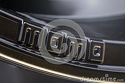 Krasnoyarsk, Russia, October 25, 2019: Momo logo car alloy wheels, black sport lightweight lightweight, black on dark background, Editorial Stock Photo